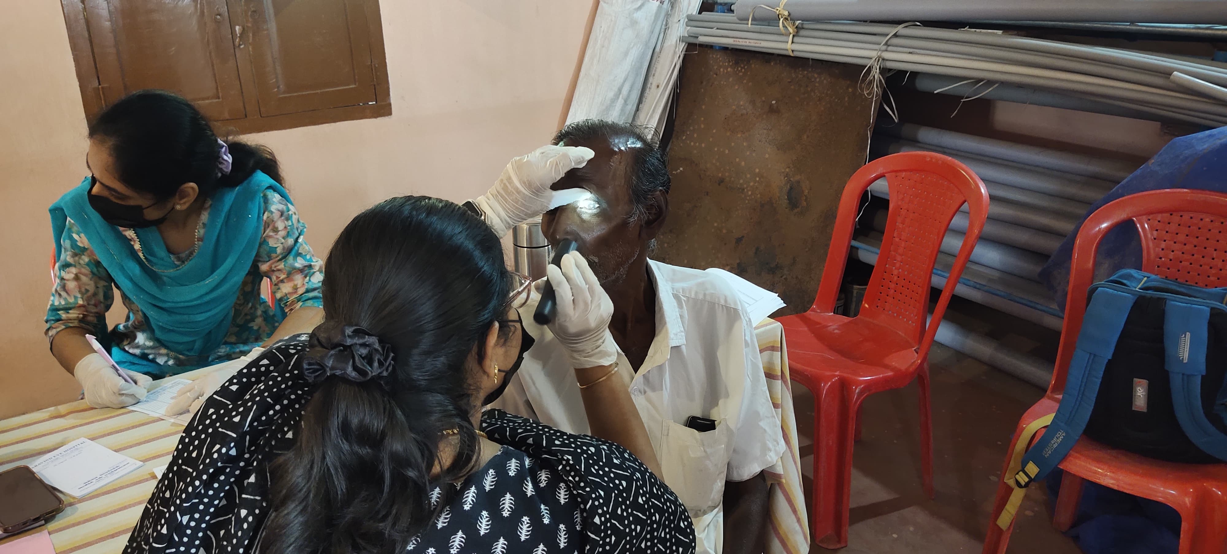 Doctor performing an eye check-up